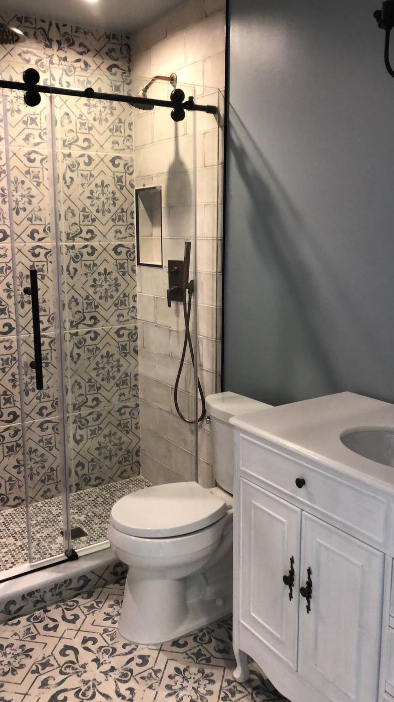 Bathroom remodel with patterned floor and new vanity
