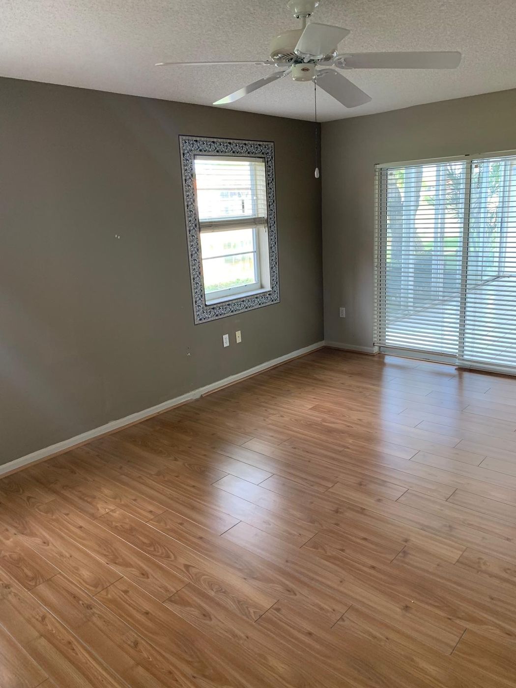 Freshly painted room with new wood-look floor